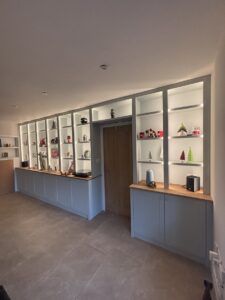 Built-in display shelving with LED lighting and oak countertop