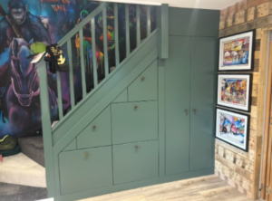Bespoke under stairs storage unit with fitted cupboards and drawers